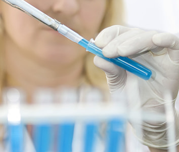 person holding blue and white bottle thumbnail