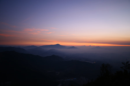 misty mountains with sun rays thumbnail