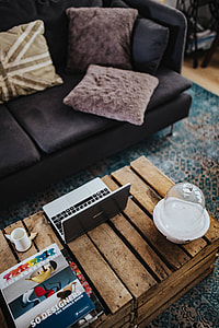 Designer living room interior with a wooden box table and a light blue carpet thumbnail