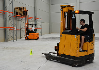 photo of two men in forklifts thumbnail