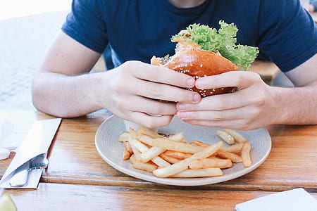 person holding burger thumbnail