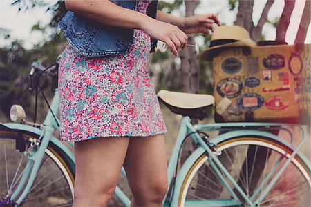 woman standing beside cruiser bike thumbnail