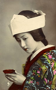 Geisha holding red sake cup thumbnail
