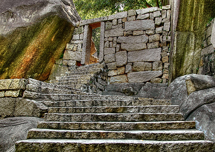brown rock staircase leading up to rock wall thumbnail