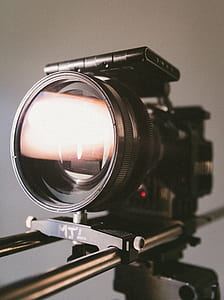 shallow photography of black DSLR camera thumbnail
