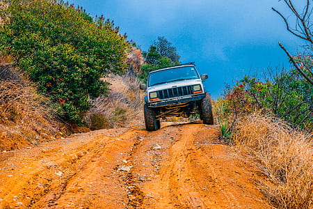 White Truck on Brown Road thumbnail