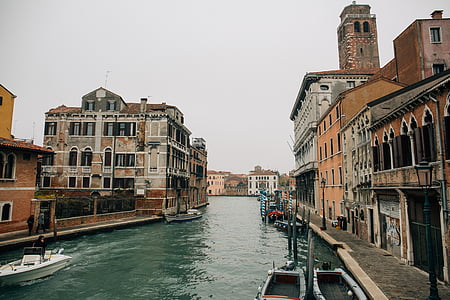 brown wall paint building near body of water thumbnail