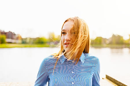Woman Posing While Behind Body of Water thumbnail