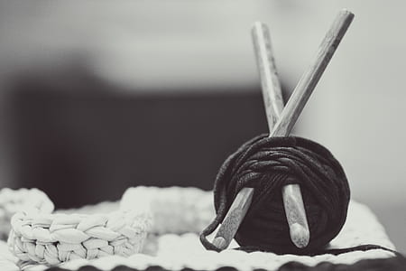 shallow focus photo of black yarn thumbnail