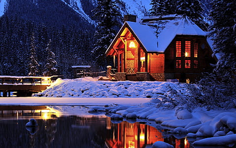 brown wooden house covered with snow thumbnail