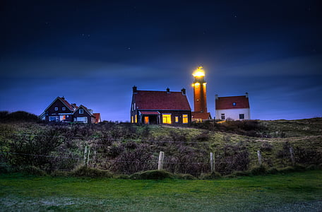 panoramic photography of lighthouse on mountain thumbnail