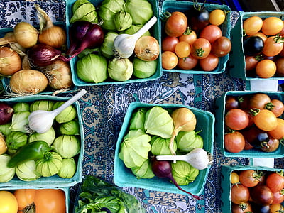 assorted-color vegetables in green plastic baskets thumbnail