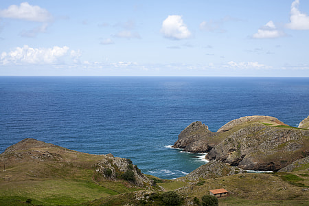 islands near sea under blue sky during daytime thumbnail