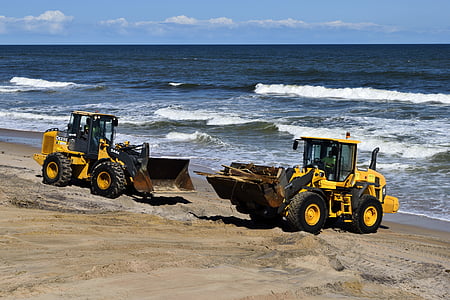 two yellow frontloaders on shorte thumbnail