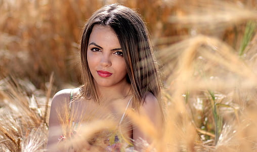 woman surrounded by grass thumbnail