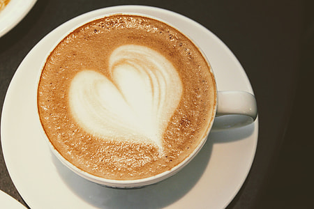 white ceramic coffee mug with brown and white foam thumbnail