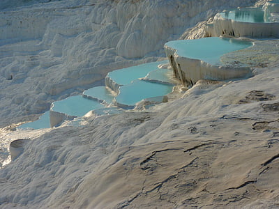white mountain and body of water landmark during daytime thumbnail