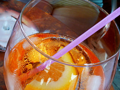 cocktail drink placed on top of brown table thumbnail