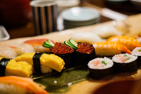 close up photography of maki roll and kimbap thumbnail