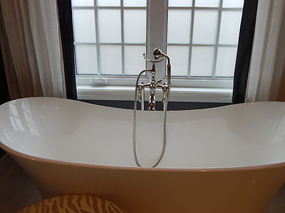 drop-in bathtub beside window thumbnail