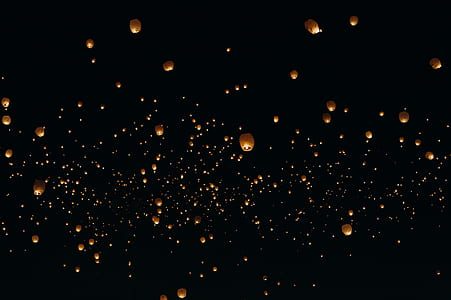 assorted sky lanterns at nighttime thumbnail