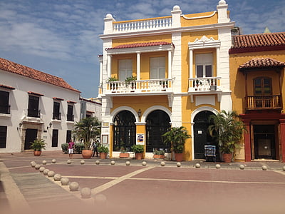 front view photography of yellow and white 2-storey building thumbnail