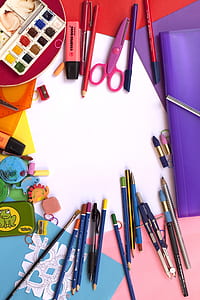 color pencils and scissors on table thumbnail