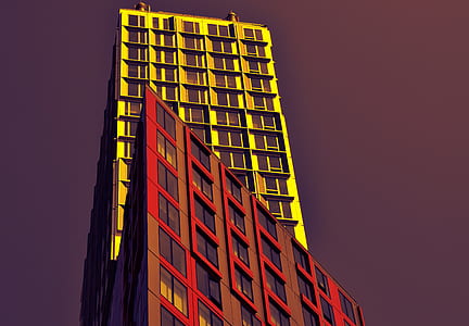 worm's-eye-view of yellow and red towering building thumbnail