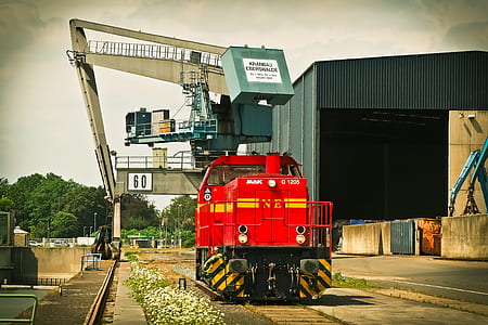 Red Mak Train on Brown Train Tracks thumbnail