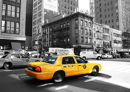 yellow taxi on road thumbnail