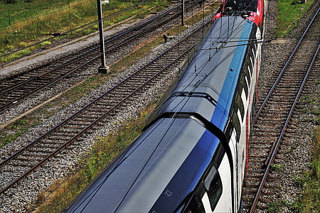 aerial photography of black and white train during daytime thumbnail