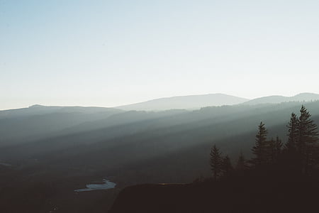silhouette of mountains under blue sky thumbnail