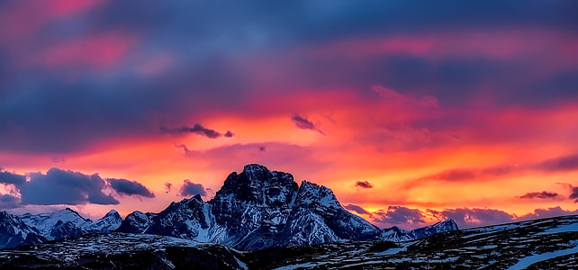 panoramic photography of mountain coated by ice under golden hour thumbnail