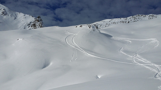 ski tracks on white snow thumbnail