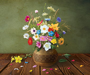 assorted-color flowers on plant pot thumbnail