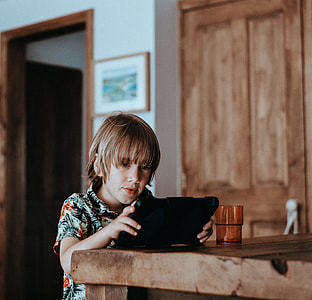 Child playing on iPad thumbnail