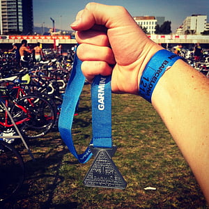 person holding silver medal thumbnail
