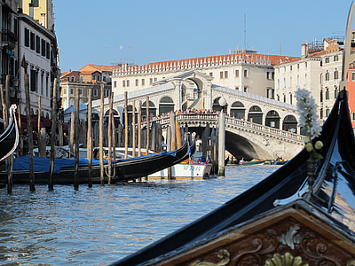 black boat near bridge during daytime thumbnail