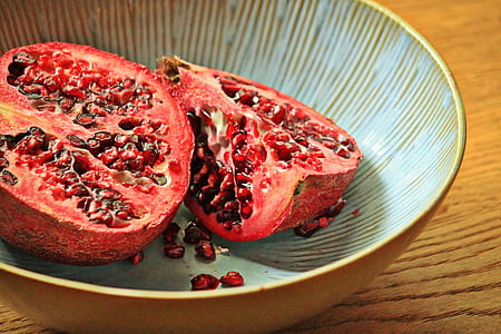 sliced pomegranate fruit on bowl thumbnail