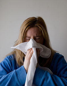 woman sneezing on handkerchief thumbnail
