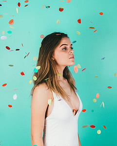 woman standing near green chroma key thumbnail