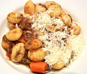 brown and white food dish with sauce thumbnail