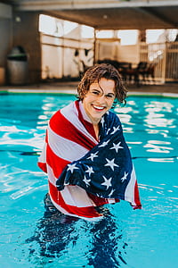 man in swimming pool wrapping towel on his body thumbnail
