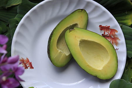 Sliced Avocado Fruits on Round White Ceramic Plate thumbnail