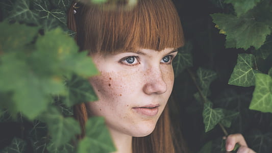 portrait photography of brunette woman surrounded with English ivy leaves thumbnail