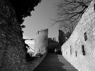 Grayscale Photography of Concrete Building With Bridge thumbnail