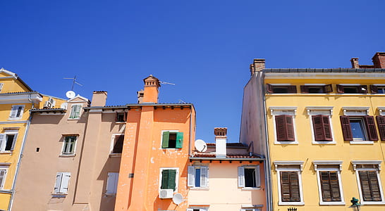 brown and yellow concrete building at daytime thumbnail
