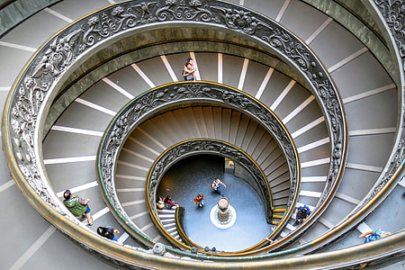 group of person walking on spiral stair thumbnail