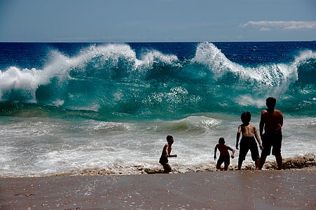 four boys playing in beach thumbnail