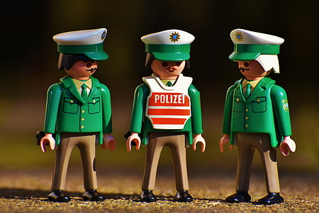 three police men in selective focus photor thumbnail